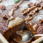 Close-up of warm caramel apple gingerbread pudding cake, perfect for fall baking.