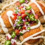 Close-up of creamy chicken rice skillet with tender chicken, rice, and a rich, creamy sauce.