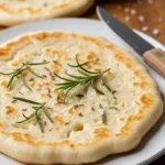 Close-up of a golden brown and delicious cottage cheese flatbread, ready to be served.