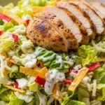 Close-up of Fiesta Ranch Chicken Salad. Creamy chicken ranch salad with colorful corn, beans, and peppers.