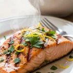 Juicy grilled honey mustard salmon on a plate. Delicious and easy salmon recipe.
