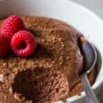 Close-up of delicious keto chocolate mousse in a glass, garnished with chocolate shavings. Sugar-free and ready in 5 minutes!
