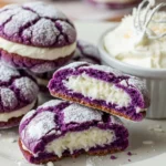 Close-up of ube crinkle sandwich cookies with creamy coconut filling, showcasing their vibrant purple color and soft texture.