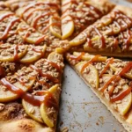 Close-up of a warm and inviting Apple Crisp Pizza, a perfect sweet dessert pizza.