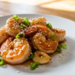 Close-up of glistening honey garlic shrimp, ready to eat. Quick and easy dinner recipe.