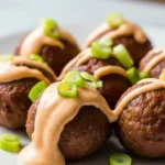Juicy Korean BBQ meatballs served with a creamy spicy mayo dip. Perfect for a quick and flavorful meal!
